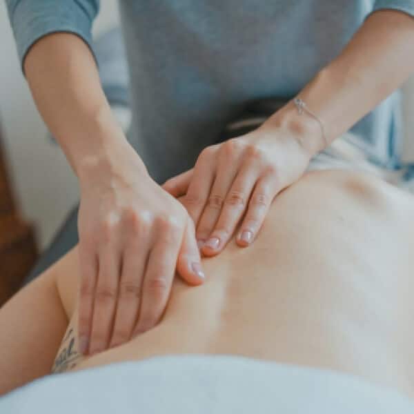 a person receiving a back massage